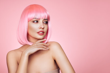 Beauty model portrait with pink hair. Bob short Haircut. Beautiful glamour Girl with short dyed hairの写真素材