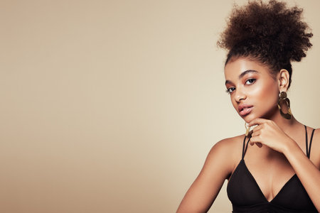Beauty portrait of African American girl with afro hair. Beautiful black woman. Cosmetics, makeup and fashionの写真素材