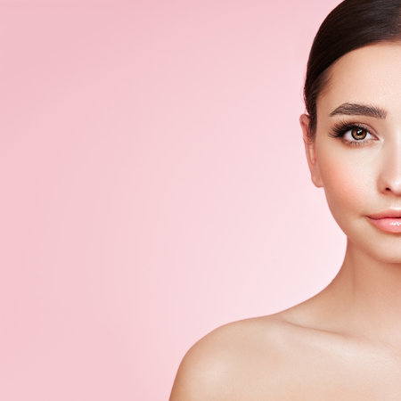 Portrait beautiful young woman with clean fresh skin. Model with healthy skin, close up portrait. Cosmetology, beauty and spaの写真素材