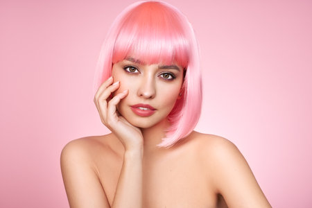 Beauty model portrait with pink hair. Bob short Haircut. Beautiful glamour Girl with short dyed hairの写真素材