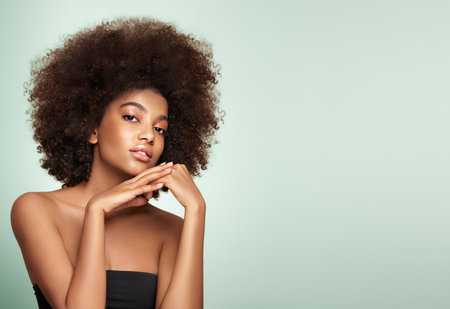 Beauty portrait of African American girl with afro hair. Beautiful black woman. Cosmetics, makeup and fashionの写真素材