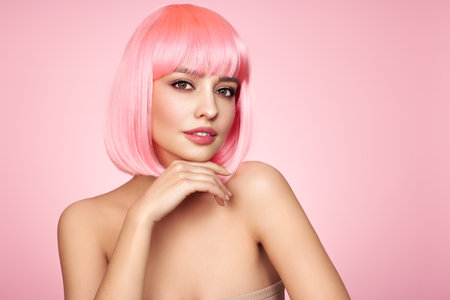 Beauty model portrait with pink hair. Bob short Haircut. Beautiful glamour Girl with short dyed hairの写真素材