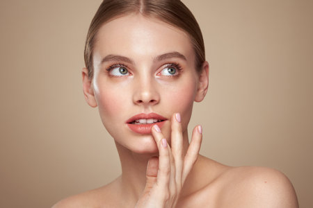 Portrait beautiful young woman with clean fresh skin. Model with healthy skin, close up portrait. Cosmetology, beauty and spaの写真素材