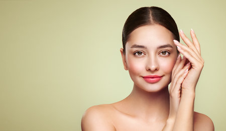 Portrait beautiful young woman with clean fresh skin. Model with healthy skin, close up portrait. Cosmetology, beauty and spaの写真素材
