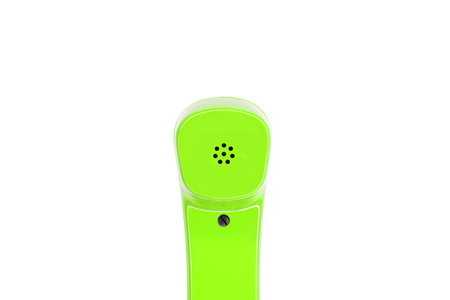 Green telephone handset in detail, isolated on a white background with textspace