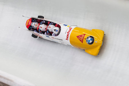Bobsleigh athlete Rico Peter of Switzerland competes with Janne Bror van der Zijde, Thomas Amrhein...