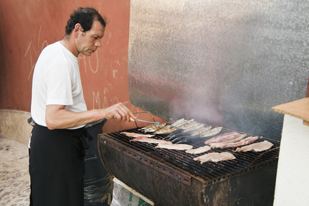 LISBON, ALFAMA, PORTUGAL - june 15, 2005 : during the feast of St. Anthony in the alleys eat sardinesのeditorial素材