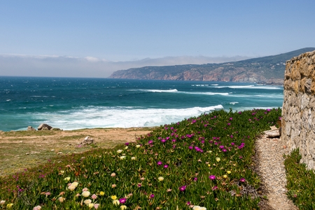 Praia do Guincho is a popular Atlantic The beach, has preferred surfing conditions and is popular for surfing, windsurfing, and kitesurfing.の写真素材