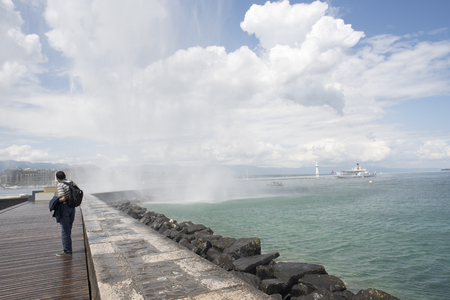 Geneva Switzerland, beautiful sunny day on the pier which leads to the water jetの写真素材