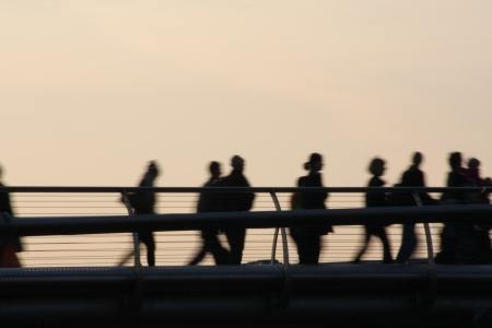 London, United Kingdom  September 28, 2008  Silhouettes of pedestrians walking on a pedestrian bridge  millennium bridge のeditorial素材