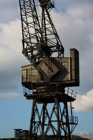 London, United Kingdom  March 14, 2010  Ancient Crane of Stothert   Pitt ltd, Bath, England, positioned in a shipyard, Docklands, Canary Wharfのeditorial素材