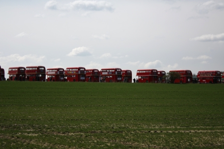 London, United Kingdom  April 11, 2010  A series of classic red Routemaster buses disposed in a row in a field in a transport fair in the London area のeditorial素材