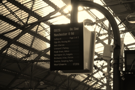 Liverpool, United Kingdom  May 24, 2011  Departure board indicating the departure time of a train directed to Manchester, and all the intermediate stopsのeditorial素材
