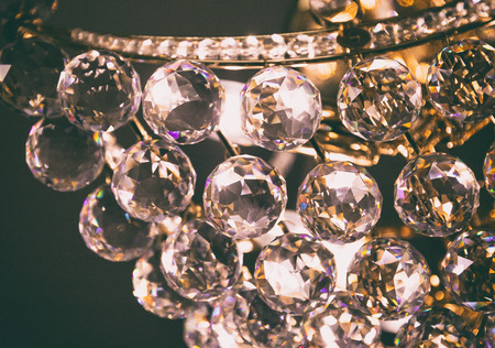 Crystal glass of chandelier that shines like a jewel in roomの写真素材