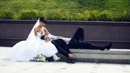 Bride and groom on the benchの写真素材