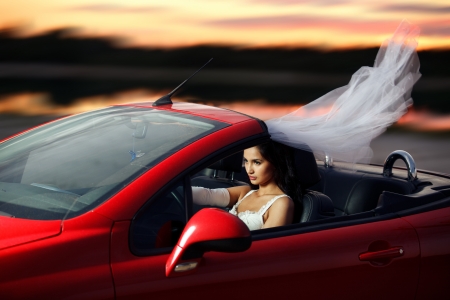 runaway bride driving a carの写真素材