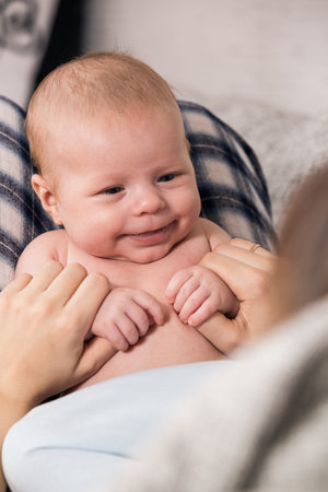 happy mother holding her babyの写真素材