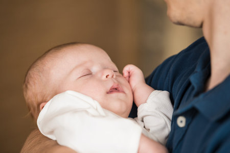 Happy Father with baby in his arms