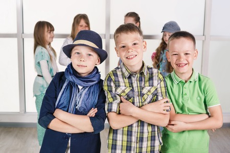 Three little boys are standing togetherの写真素材