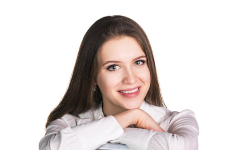 Portrait of a happy young business woman smiling - isolated on whiteの写真素材