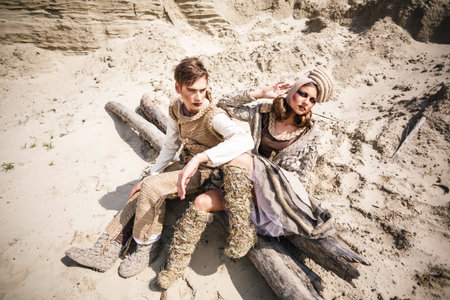 Sexy couple posing in desertの写真素材