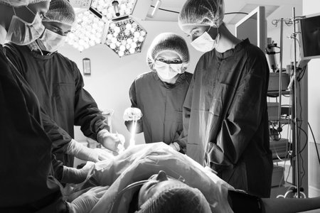 Surgery team operating in a surgical room