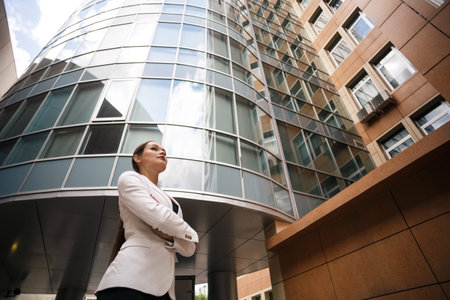 Beautiful young business woman  Modern building behind her