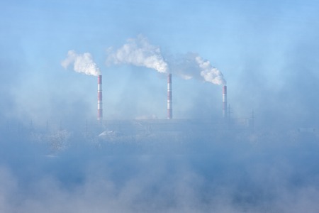 Factory pipes polluting air, environmental problemsの写真素材