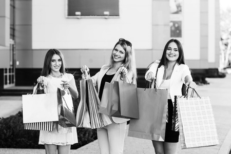Shopping - beautiful girls with shopping bags in ctiyの写真素材