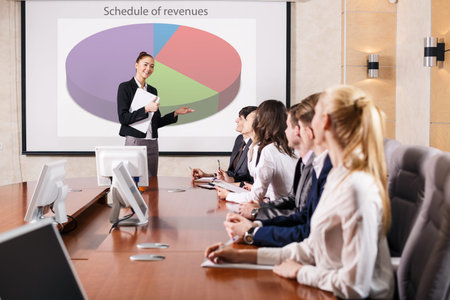 Business consultant answering a question during a meeting at office