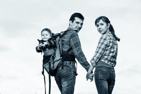 Baby boy in backpack carrier on walking tour.の写真素材