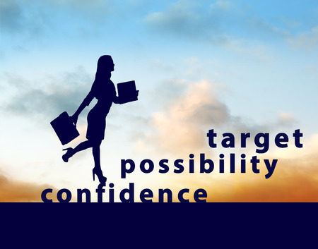 Image of confident businesswoman with briefcase walking up to targetの写真素材