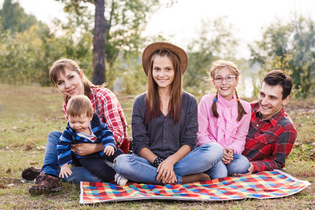 Happy frendly family have a picnic outdoorの写真素材