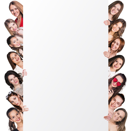 Successful team standing with billboard isolated on whiteの写真素材