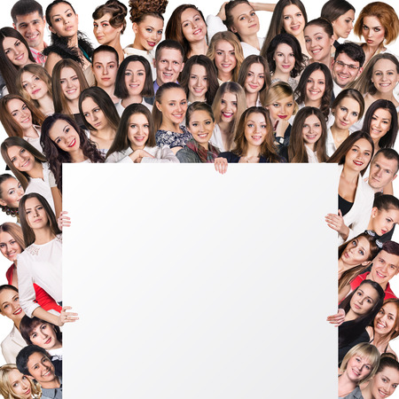 Successful team standing with billboard isolated on whiteの写真素材