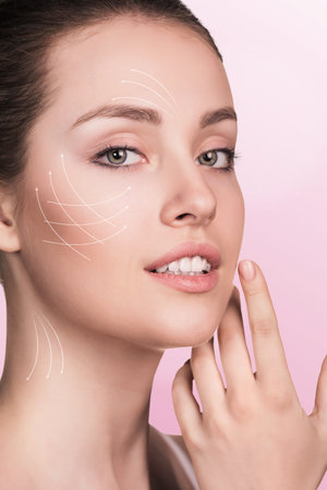 Young happy female with clean fresh skin, white background