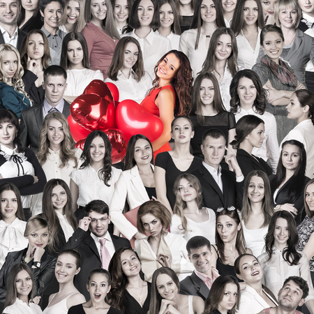 Colored people on the background of gray crowdの写真素材