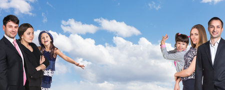 Happy caucasian family on the background of skyの写真素材