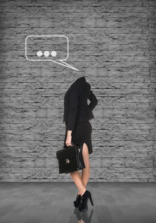 Headless businesswoman in office suit with briefcase and text sign overheadの写真素材