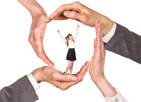 Hands holding woman between palms over white backgroundの写真素材
