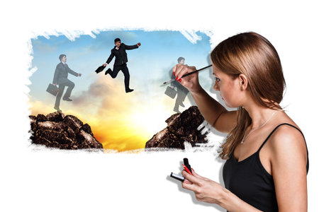 Smiling female artist drowing picture of businessman motionの写真素材