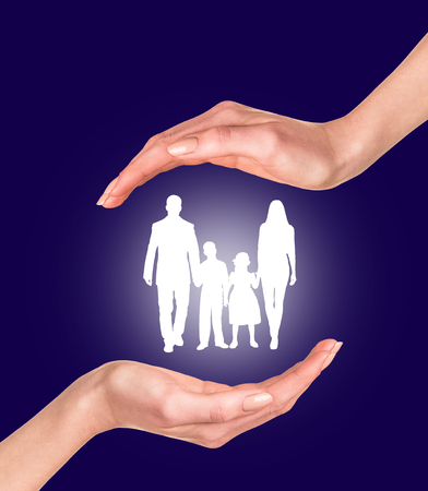 Family in hands isolated on the white backgroundの写真素材