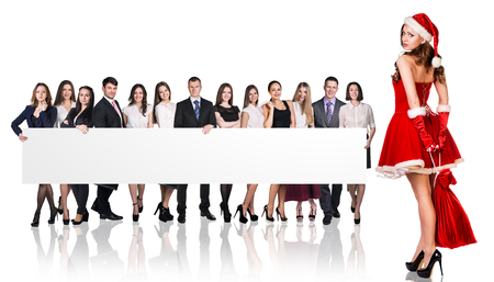 Santa girl and large group of business people holding empty bannerの写真素材