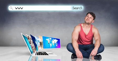 Laptop with many screens stand on the floor and man beside.の写真素材