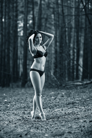 Portrait of a beautiful mysterious woman in the forestの写真素材