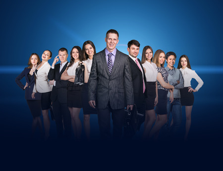Business people stand on the blue backgroundの写真素材