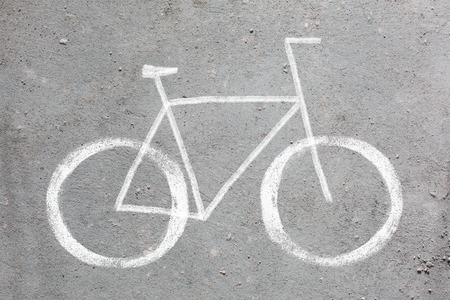 Sign of bycycle drawing on the gray wall.の写真素材