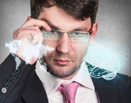 Businessman working with a futuristic glasses. Elements of this image furnished by NASAの写真素材
