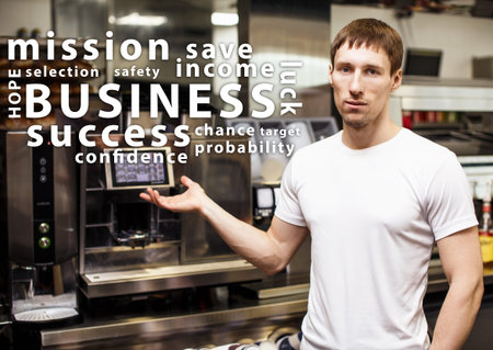 Portrait of worker in coffeeshop shows equipment and words cloud