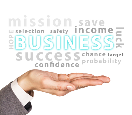Business words cloud on hand isolated on whiteの写真素材